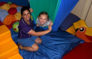 Occupational therapist with child in Darwin