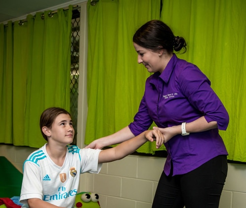 Teenager with paediatric physiotherapist at Stepping Stones in Darwin