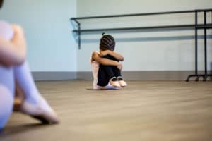 sad girl in ballet class